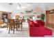 Living room featuring ample seating, wet bar, game room, and decorative fish decor at 2805 N Beach Rd # B, Englewood, FL 34223