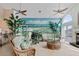 Bright living room with beautiful mural art, ceiling fans, and stylish decor at 2805 N Beach Rd # B, Englewood, FL 34223