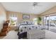 Bedroom with a large bed, side table, and view of the water from the windows at 2805 N Beach Rd # B, Englewood, FL 34223
