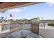 Outdoor patio with seating and scenic views of the waterway and nearby homes at 2805 N Beach Rd # B, Englewood, FL 34223