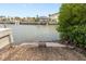 Waterfront property showing a boat ramp into canal leading to open water and surrounding homes at 2805 N Beach Rd # B, Englewood, FL 34223
