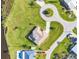 Bird's eye view of home with lush green yard, mature trees, pool, and circular driveway at 3522 Fox Ter, Port Charlotte, FL 33981