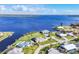 Stunning aerial view of waterfront homes with beautiful landscaping and a wide canal at 3522 Fox Ter, Port Charlotte, FL 33981