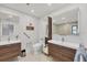 Modern bathroom with double sinks, sleek cabinetry, and a spacious shower at 3522 Fox Ter, Port Charlotte, FL 33981