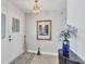 Inviting entryway features elegant decor, a stylish chandelier, and a welcoming ambiance at 3522 Fox Ter, Port Charlotte, FL 33981