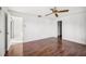 Bright bedroom featuring wood flooring and a ceiling fan at 4204 Cockrell St, Port Charlotte, FL 33948