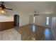 Living room with wood floors, ceiling fan, and natural light at 4204 Cockrell St, Port Charlotte, FL 33948