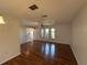 Spacious living room with hardwood floors, bright windows, and ample lighting at 4204 Cockrell St, Port Charlotte, FL 33948