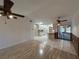 Living room showcases an open concept to kitchen and sunroom at 4204 Cockrell St, Port Charlotte, FL 33948