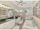 Luxury bathroom features double vanity, soaking tub, and tile backsplash at 1061 Boundary Blvd, Rotonda West, FL 33947