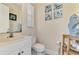 Charming half bathroom featuring coastal decor and a bright, clean aesthetic at 1061 Boundary Blvd, Rotonda West, FL 33947