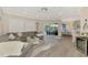 Open concept living space flows to the lanai and features a bar with wine cooler at 1061 Boundary Blvd, Rotonda West, FL 33947