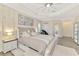 This comfortable main bedroom offers neutral walls, tray ceiling and lots of natural light at 1061 Boundary Blvd, Rotonda West, FL 33947
