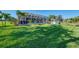 Spacious backyard with a screened lanai and meticulously maintained lawn at 1061 Boundary Blvd, Rotonda West, FL 33947
