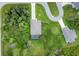 Birds eye view of a single Gathering home with an enclosed pool and lush green backyard in a community at 108 Wagon Place, Rotonda West, FL 33947
