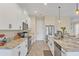 Spacious kitchen featuring stainless steel appliances and granite countertops at 108 Wagon Place, Rotonda West, FL 33947