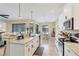 Open-concept kitchen with stainless appliances and a view to the dining area at 108 Wagon Place, Rotonda West, FL 33947
