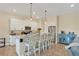 Stylish kitchen featuring white cabinets, granite countertops, and stainless steel appliances at 108 Wagon Place, Rotonda West, FL 33947