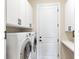 Convenient laundry room with a modern washer and dryer at 108 Wagon Place, Rotonda West, FL 33947