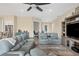 Open-concept living area with view of kitchen, a large television and modern furnishings at 108 Wagon Place, Rotonda West, FL 33947