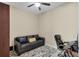Comfortable office space with a leather couch, desk and fan at 108 Wagon Place, Rotonda West, FL 33947