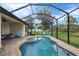 Beautiful pool with a screened-in enclosure and an expansive patio area at 108 Wagon Place, Rotonda West, FL 33947