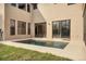 Beautiful backyard with in-ground pool, patio area, and sliding doors that provide seamless indoor/outdoor living at 117 Cable Dr, Rotonda West, FL 33947
