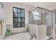 Bright bathroom featuring a soaking tub and glass-enclosed shower at 117 Cable Dr, Rotonda West, FL 33947