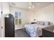 Bedroom featuring shutters, ceiling fan, and neutral decor at 117 Cable Dr, Rotonda West, FL 33947