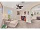 Well-lit bedroom with an accent chair and workspace at 117 Cable Dr, Rotonda West, FL 33947