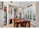 Bright dining room features a wood table, matching chairs, and a sunny window at 117 Cable Dr, Rotonda West, FL 33947