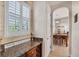 A well-lit dining room with a granite counter and a lovely Gathering decor at 117 Cable Dr, Rotonda West, FL 33947