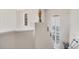 A staircase with white walls, a white banister, and white shutters at 117 Cable Dr, Rotonda West, FL 33947