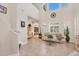 Bright living room with soaring ceilings, tile flooring, and large windows with plantation shutters at 117 Cable Dr, Rotonda West, FL 33947