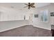 Open loft space with neutral carpet and shuttered windows at 117 Cable Dr, Rotonda West, FL 33947