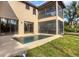 Beautiful in-ground pool and patio area with screened-in porch perfect for outdoor relaxation at 117 Cable Dr, Rotonda West, FL 33947