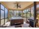 Relaxing screened porch with a hot tub and barbecue grill at 117 Cable Dr, Rotonda West, FL 33947