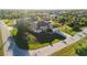 Expansive aerial view showcasing the home's landscaping, and neighborhood amenities at 13575 Chenille Dr, Port Charlotte, FL 33981