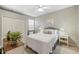 Well-lit bedroom with a soft color palette, closet, and decorative accents at 13575 Chenille Dr, Port Charlotte, FL 33981