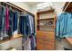 Custom closet with ample storage including shelving, drawers, and racks for clothes at 13575 Chenille Dr, Port Charlotte, FL 33981