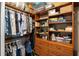 Walk-in closet offering ample storage with shelving, drawers, and hanging racks at 13575 Chenille Dr, Port Charlotte, FL 33981