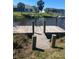 Private wooden dock with sturdy pilings, providing direct access to serene water views and recreational activities at 13575 Chenille Dr, Port Charlotte, FL 33981