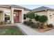 Charming home featuring beautiful landscaping, a well-maintained lawn, and a welcoming entrance at 13575 Chenille Dr, Port Charlotte, FL 33981