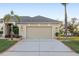 Spacious two-car garage with well-kept driveway and appealing curb appeal at 13575 Chenille Dr, Port Charlotte, FL 33981