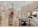 A kitchen featuring a center island, modern appliances, and a seamless transition to outdoor living at 13575 Chenille Dr, Port Charlotte, FL 33981
