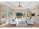 This bright living room offers tile floors, comfortable seating, and sliding glass doors to the lanai at 13575 Chenille Dr, Port Charlotte, FL 33981