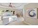 Bright bedroom featuring a king bed, neutral decor, and lots of natural light at 13575 Chenille Dr, Port Charlotte, FL 33981