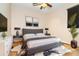 Main bedroom featuring wood floors, decor, and a ceiling fan at 214 W Pine Valley Ln, Rotonda West, FL 33947