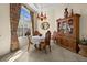 Bright dining area with charming decor, hardwood furnishings, and window with natural light at 411 Boundary Blvd, Rotonda West, FL 33947