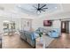 Comfortable living area with a TV, cozy seating, and an open layout to the dining area at 497 Rotonda Cir, Rotonda West, FL 33947
